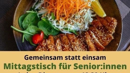 Ein Teller mit Essen und der Aufschrift "Gemeinsam statt einsam"